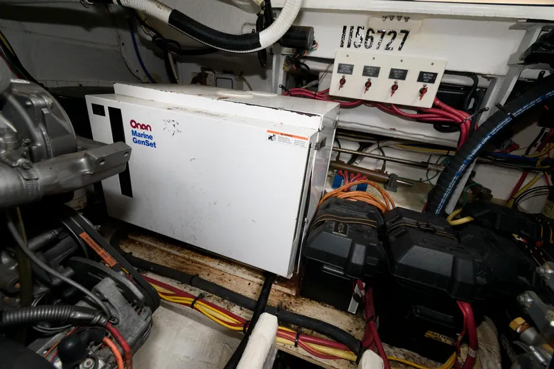 Slide: The Image of 2004 Cruisers Yachts 370 Express engine room with Onan Marine GenSet. - 17