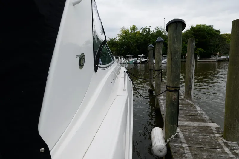 Slide: The Image of 2004 Cruisers Yachts 370 Express docked at a marina. - 7