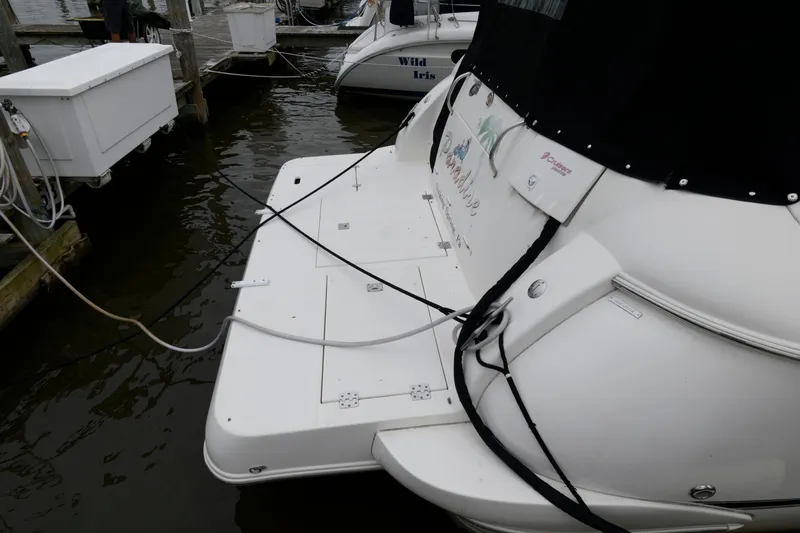 Slide: The Image of 2004 Cruisers Yachts 370 Express docked at a marina. - 8