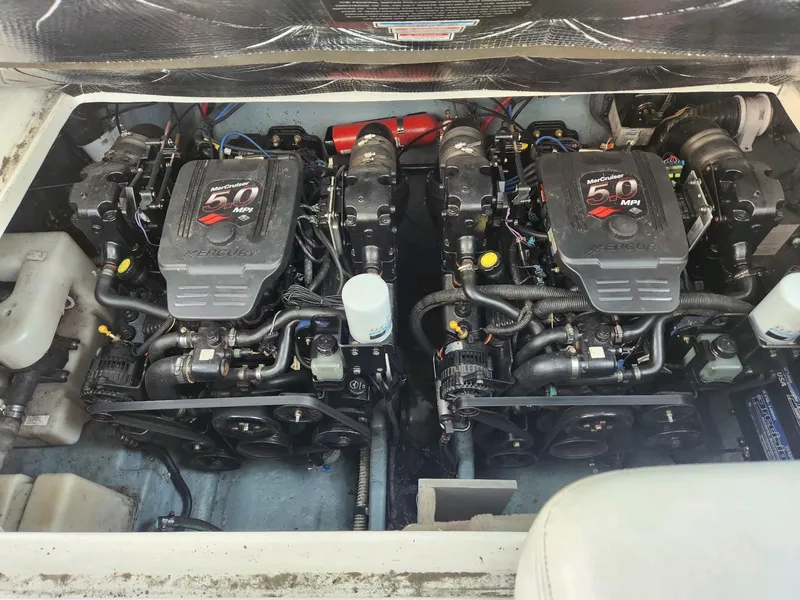 Slide: The Image of 2004 Sea Ray 280 Sundancer engine compartment with twin MerCruiser 5.0 MPI engines. - 13