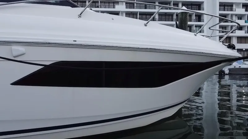 Slide: The Image of 2020 Sea Ray Sundancer 320 OB docked, showcasing sleek design and modern features. - 17