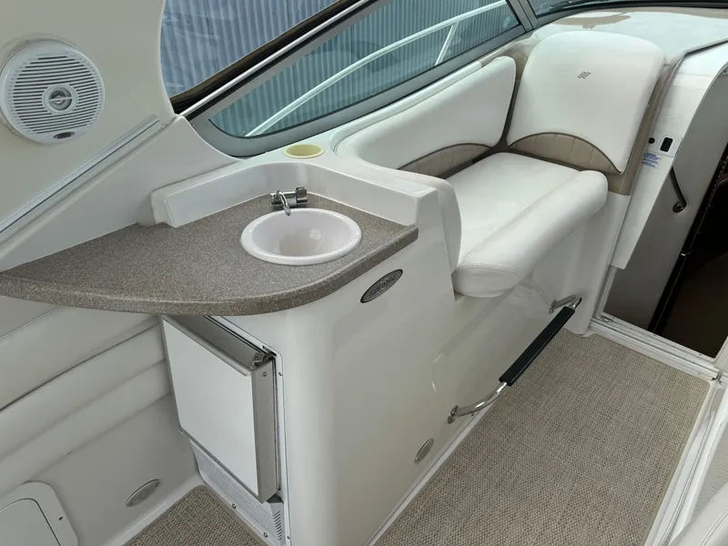 Slide: The Image of 2005 Four Winns 328 Vista boat interior with sink and seating area. - 10