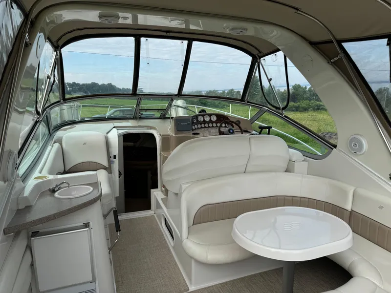 Slide: The Image of Interior of 2005 Four Winns 328 Vista boat with seating and helm. - 12