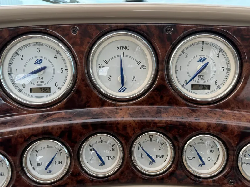 Slide: The Image of Dashboard of a 2005 Four Winns 328 Vista boat with various gauges and indicators. - 15