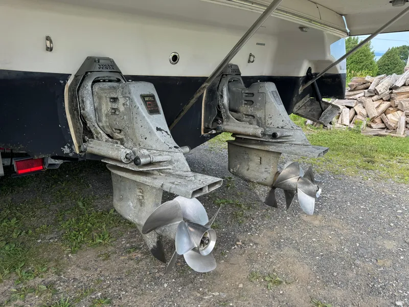 Slide: The Image of 2005 Four Winns 328 Vista boat propellers and stern drives on gravel. - 5