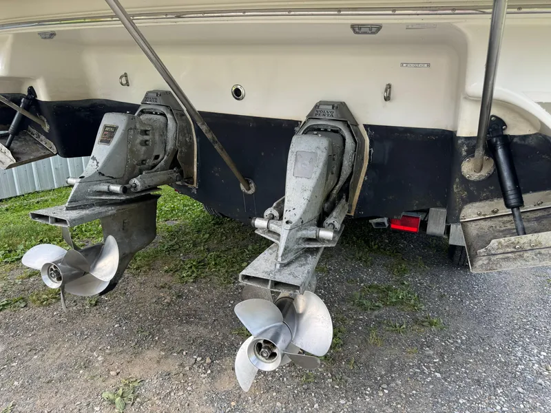 Slide: The Image of 2005 Four Winns 328 Vista boat with dual propellers on a gravel surface. - 6