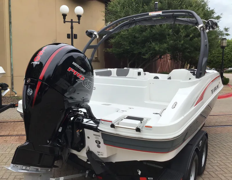 Slide: The Image of 2024 Tahoe 1950 boat with Mercury Pro XS outboard motor, parked on trailer. - 4