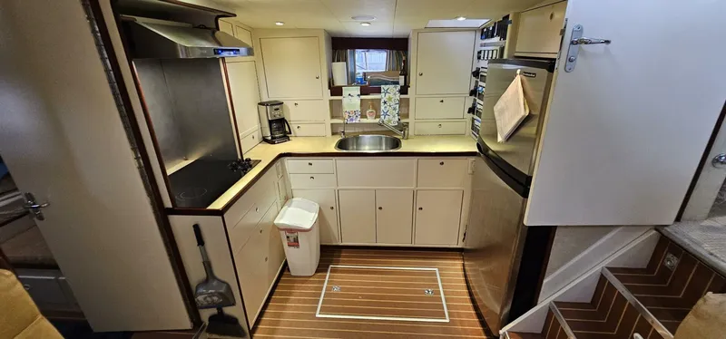 Slide: The Image of Interior of 1969 Derecktor 68 Hunt Motor Yacht with elegant seating and decor. - 11