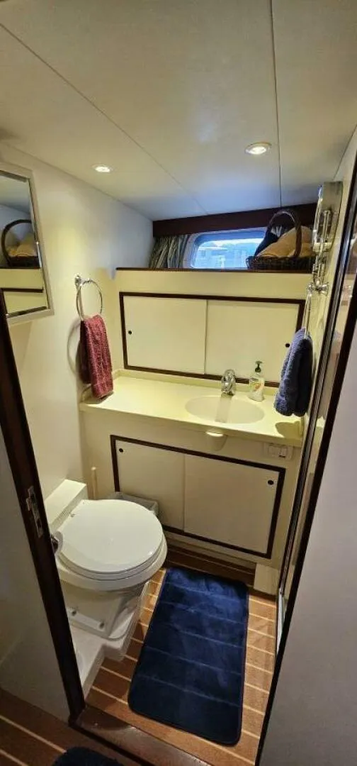 Slide: The Image of Interior of 1969 Derecktor 68 Hunt Motor Yacht with cozy dining area and storage. - 14