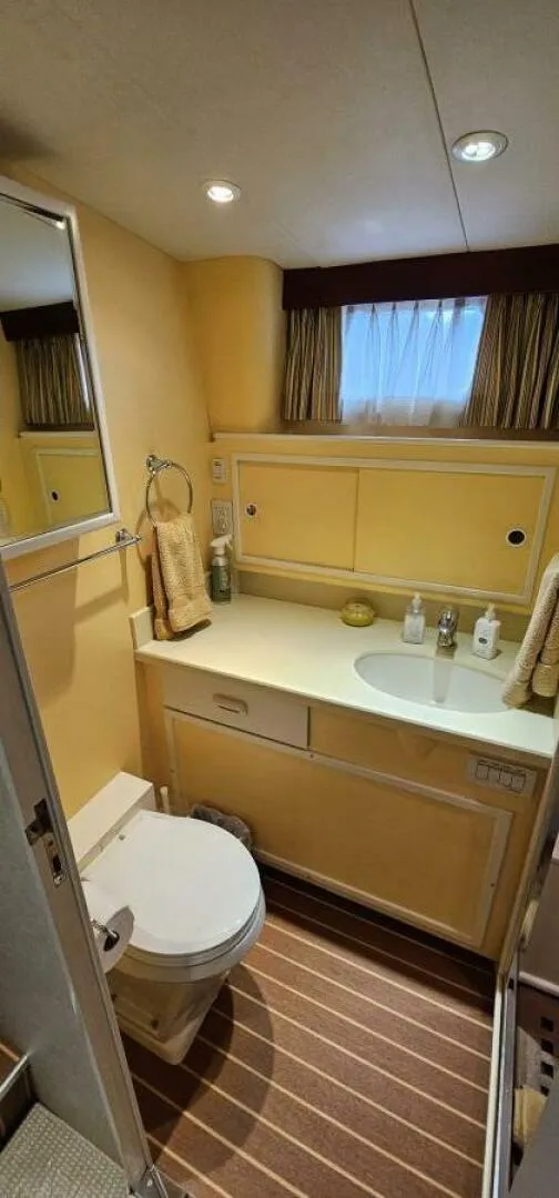 Slide: The Image of Interior of 1969 Derecktor 68 Hunt Motor Yacht with twin beds and wall-mounted TV. - 18