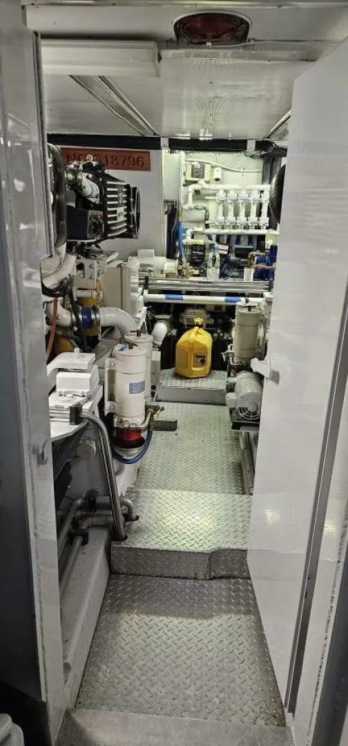 Slide: The Image of Engine room of 1969 Derecktor 68 Hunt Motor Yacht, showcasing machinery and equipment. - 21