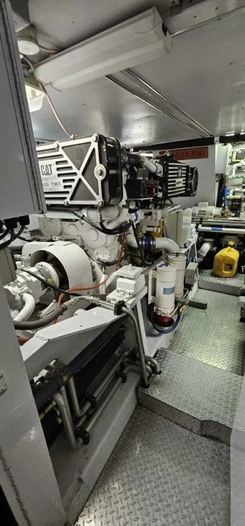 Slide: The Image of Engine room of 1969 Derecktor 68 Hunt Motor Yacht, featuring mechanical components and equipment. - 22