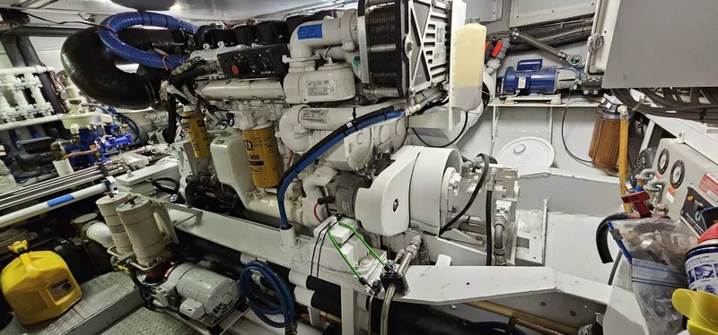 Slide: The Image of Engine room of 1969 Derecktor 68 Hunt Motor Yacht, showcasing mechanical components. - 24