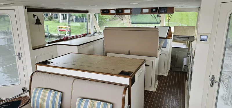 Slide: The Image of Interior of 1969 Derecktor 68 Hunt Motor Yacht with seating and dining area. - 6