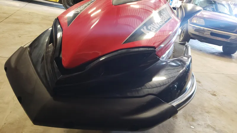 Slide: The Image of 2019 Kawasaki Jetski Ultra 310X in a garage, featuring a sleek red and black design. - 4