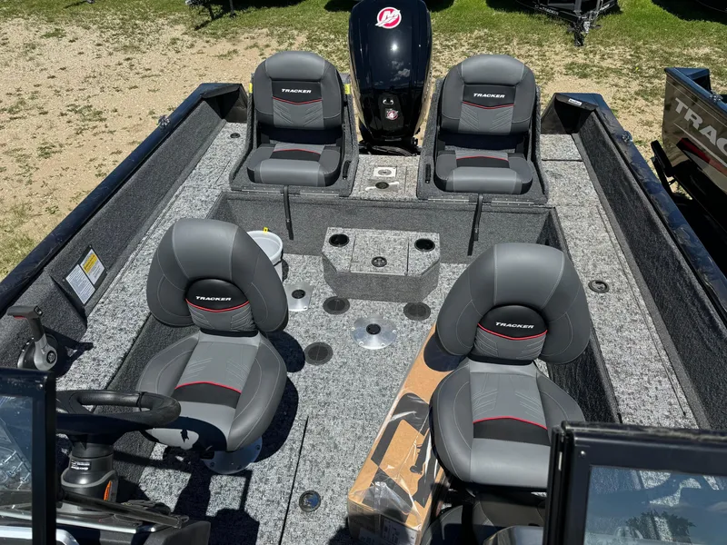 Slide: The Image of 2024 Tracker Pro Guide V-175 Combo boat interior with seating and motor. - 19