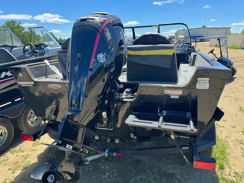 Slide: The Image of 2024 Tracker Pro Guide V-175 Combo boat, rear view with outboard motor. - 5