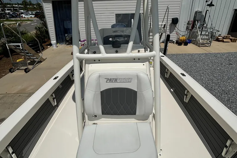 Slide: The Image of 2021 Pathfinder 2500 Hybrid boat interior with seating and console. - 13