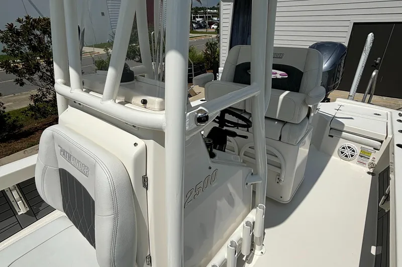 Slide: The Image of 2021 Pathfinder 2500 Hybrid boat interior with seating and console. - 14