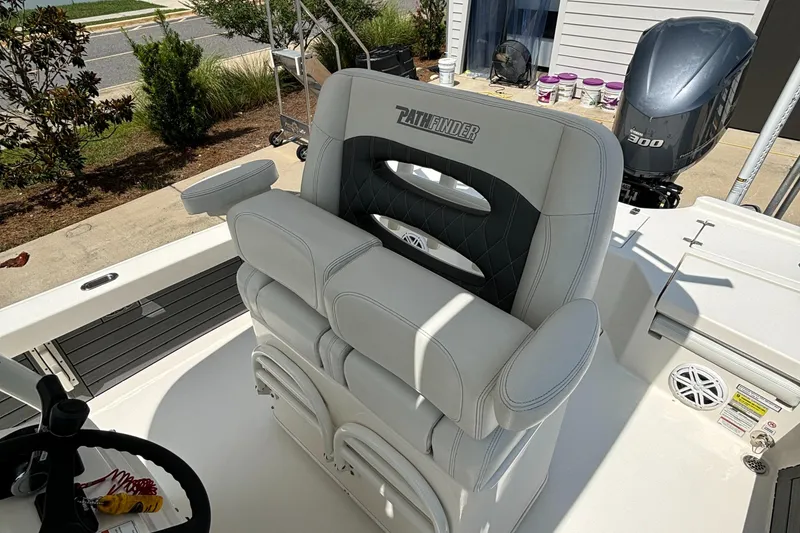 Slide: The Image of 2021 Pathfinder 2500 Hybrid boat with cushioned seating and Yamaha 300 outboard motor. - 17