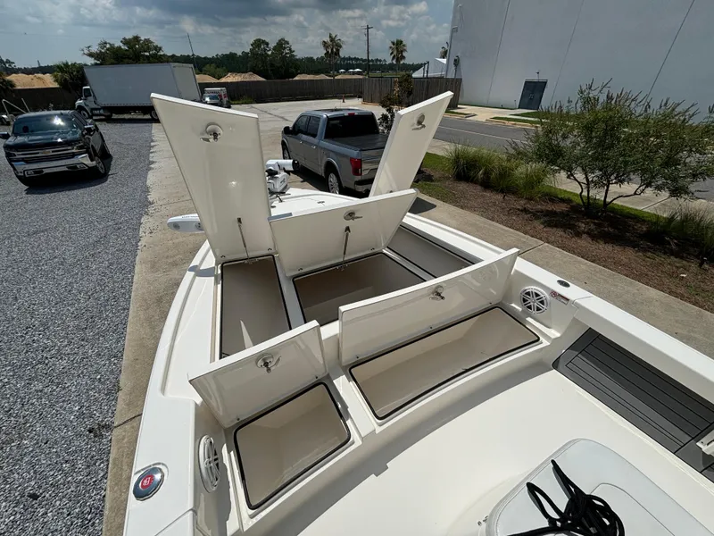 Slide: The Image of 2021 Pathfinder 2500 Hybrid boat with open storage compartments. - 8