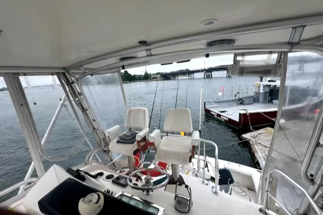 Slide: The Image of Interior view of 2002 Cabo 35 Flybridge boat at dock. - 13