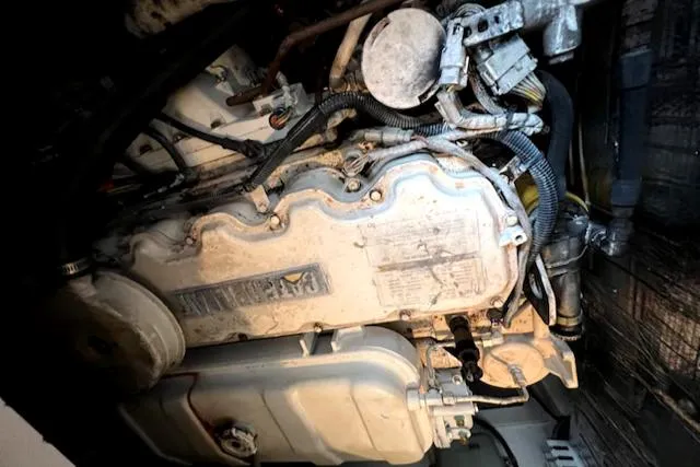 Slide: The Image of Engine compartment of a 2002 Cabo 35 Flybridge boat. - 22