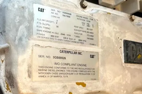 Slide: The Image of Caterpillar engine specifications on a 2002 Cabo 35 Flybridge boat. - 23