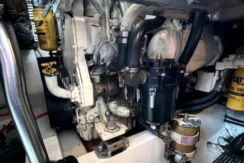 Slide: The Image of Engine compartment of a 2002 Cabo 35 Flybridge boat. - 27