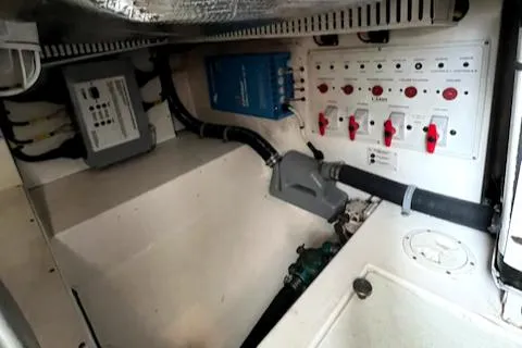 Slide: The Image of Electrical panel and wiring in a 2002 Cabo 35 Flybridge boat. - 29