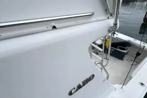 Slide: The Image of 2002 Cabo 35 Flybridge boat deck and railing. - 33