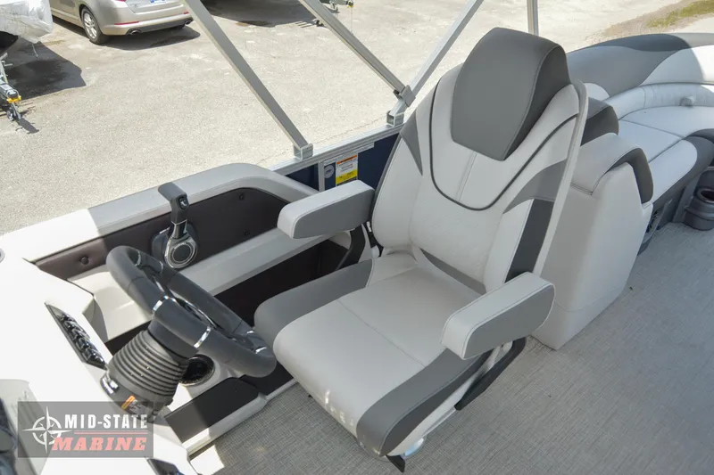 Slide: The Image of 2024 Tahoe Pontoon LTZ Quad Lounger captain's chair and helm station. - 10