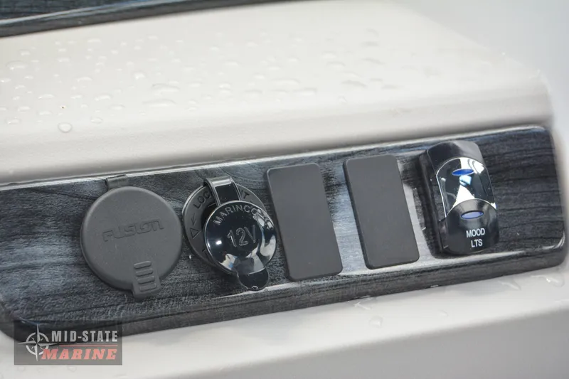 Slide: The Image of Close-up of control panel on 2024 Tahoe Pontoon LTZ Quad Lounger boat. - 13