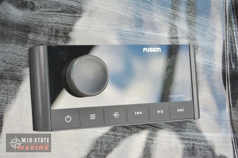 Slide: The Image of Fusion audio control panel on 2024 Tahoe Pontoon LTZ Quad Lounger. - 15