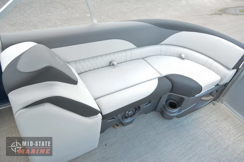Slide: The Image of 2024 Tahoe Pontoon LTZ Quad Lounger interior seating with gray and white upholstery. - 18