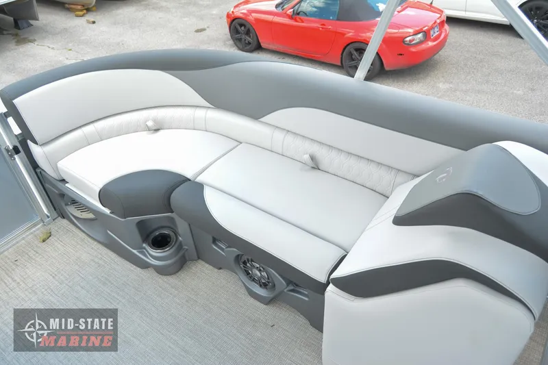 Slide: The Image of 2024 Tahoe Pontoon LTZ Quad Lounger interior with gray and white seating. - 19