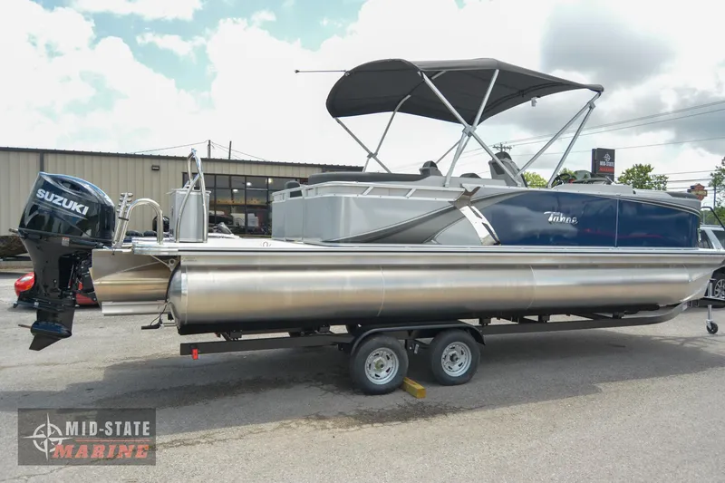 Slide: The Image of 2024 Tahoe Pontoon LTZ Quad Lounger on trailer at Mid-State Marine. - 2