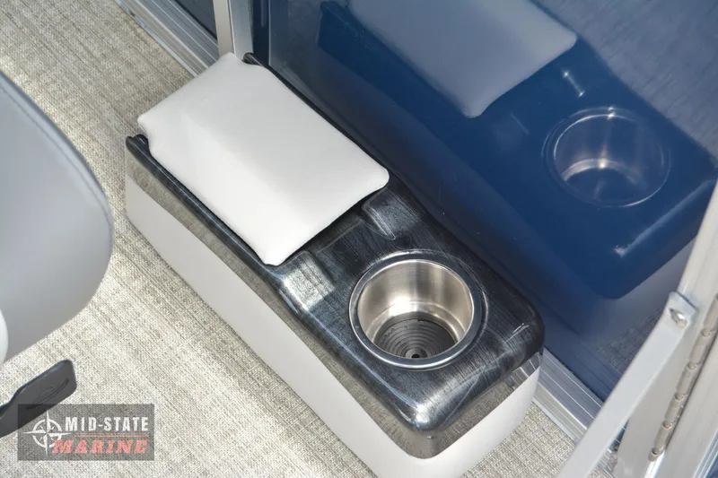 Slide: The Image of 2024 Tahoe Pontoon LTZ Quad Lounger cup holder and armrest detail. - 27
