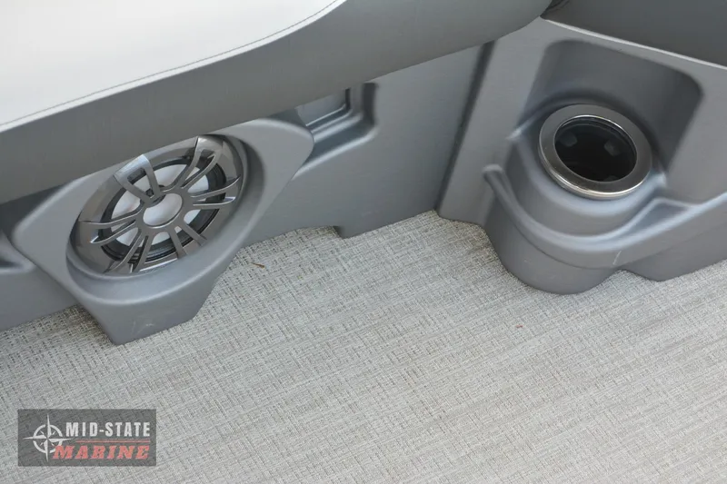 Slide: The Image of 2024 Tahoe Pontoon LTZ Quad Lounger speaker and cup holder detail. - 28