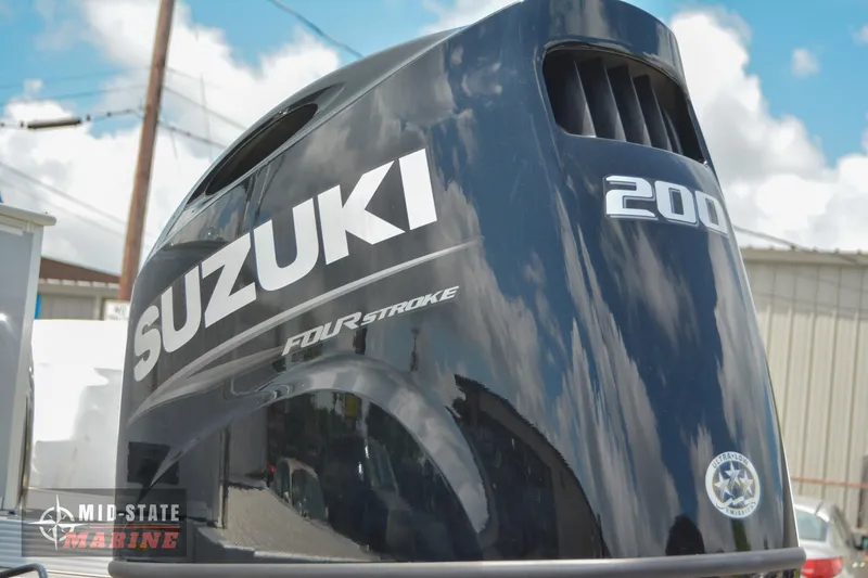 Slide: The Image of Suzuki 200 horsepower four-stroke outboard motor on a 2024 Tahoe Pontoon LTZ Quad Lounger. - 5