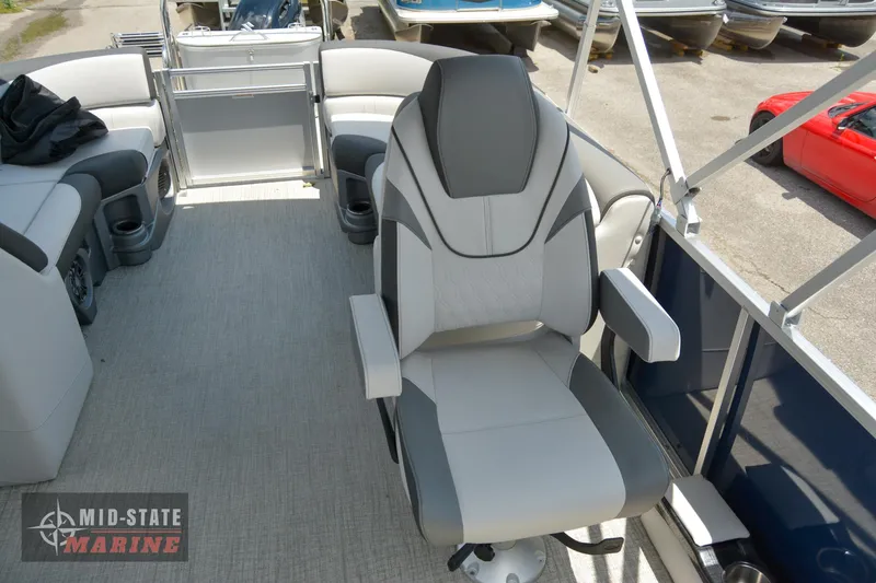 Slide: The Image of 2024 Tahoe Pontoon LTZ Quad Lounger interior with captain's chair and Mid-State Marine logo. - 9