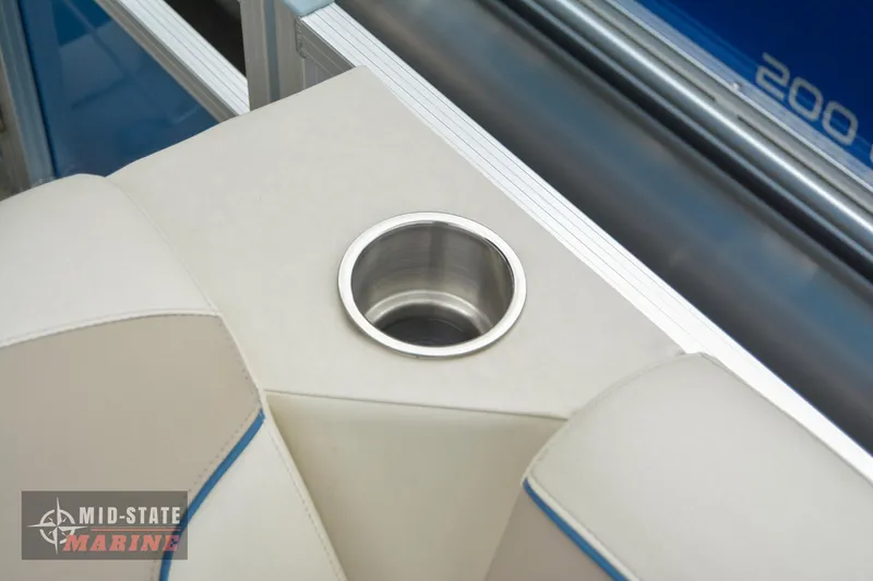 Slide: The Image of Cup holder on 2024 Tahoe Pontoon Sport 85 Quad Lounger boat, beige seating. - 20