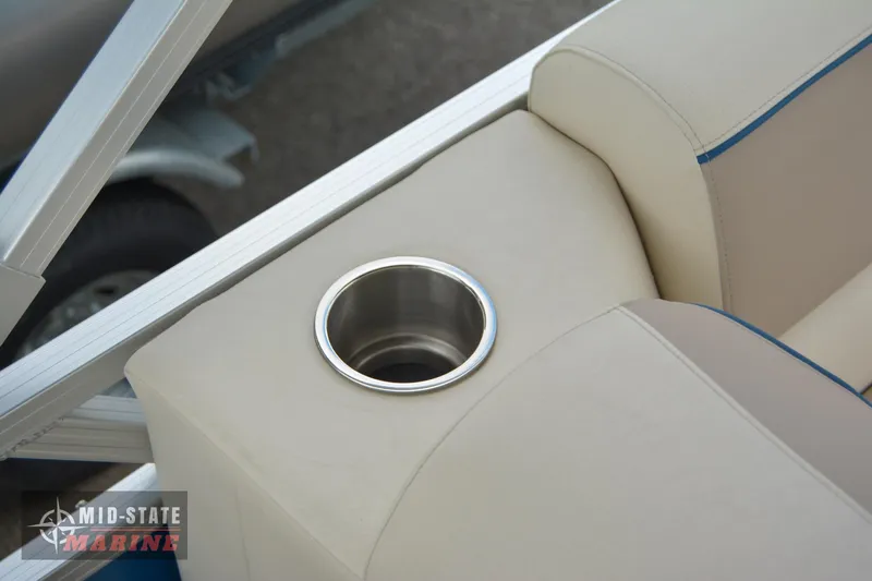 Slide: The Image of 2024 Tahoe Pontoon Sport 85 Quad Lounger cup holder and seating detail. - 21