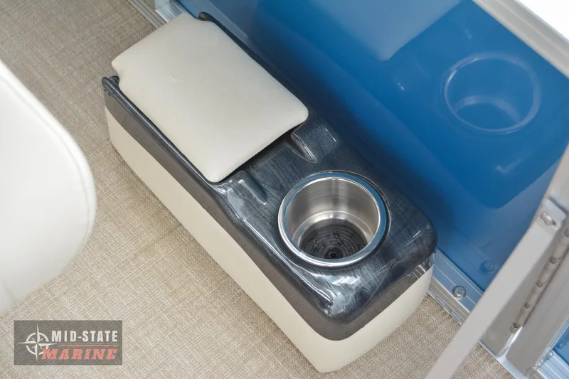 Slide: The Image of 2024 Tahoe Pontoon Sport 85 Quad Lounger cup holder and armrest detail. - 29