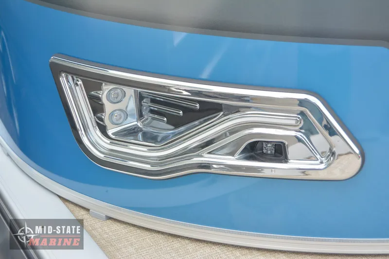 Slide: The Image of 2024 Tahoe Pontoon Sport 85 Quad Lounger, close-up of sleek blue exterior and modern light fixture. - 4