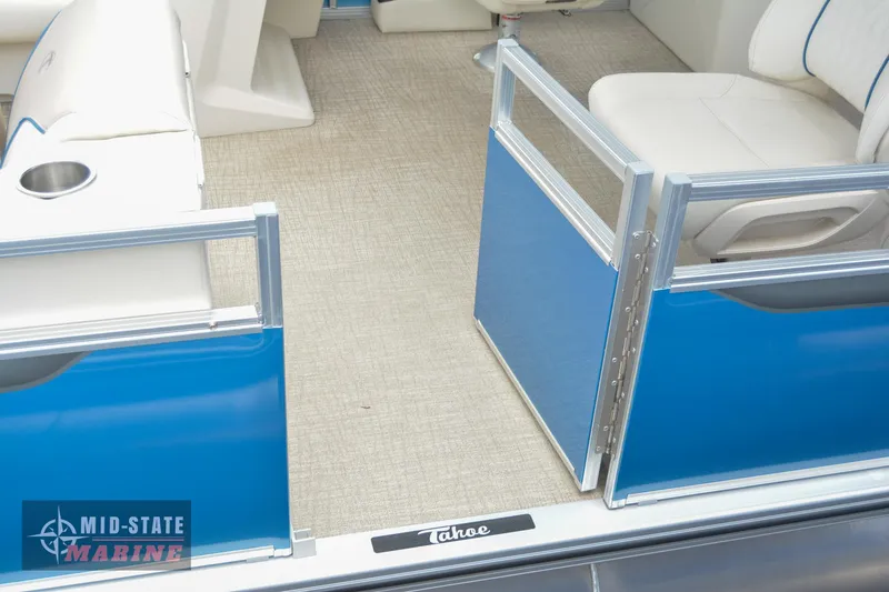 Slide: The Image of 2024 Tahoe Pontoon Sport 85 Quad Lounger interior with blue gates and beige seating. - 5