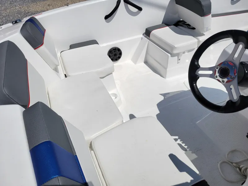 Slide: The Image of 2024 Tahoe T16 boat interior with seating and steering wheel. - 10