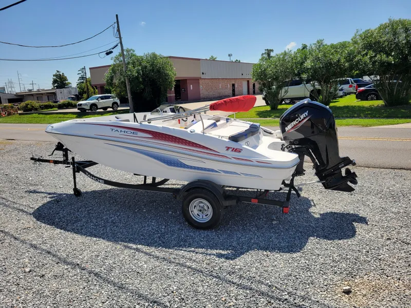 Slide: The Image of 2024 Tahoe T16 boat on a trailer with a Mercury outboard motor. - 3