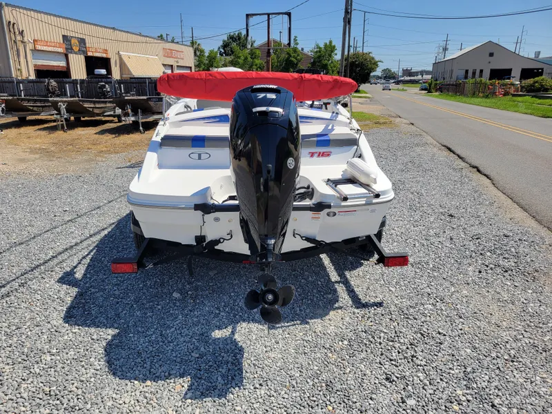 Slide: The Image of 2024 Tahoe T16 boat with outboard motor on gravel lot. - 4