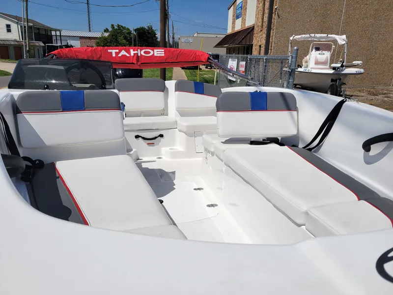 Slide: The Image of 2024 Tahoe T16 boat interior with white and blue seating. - 9